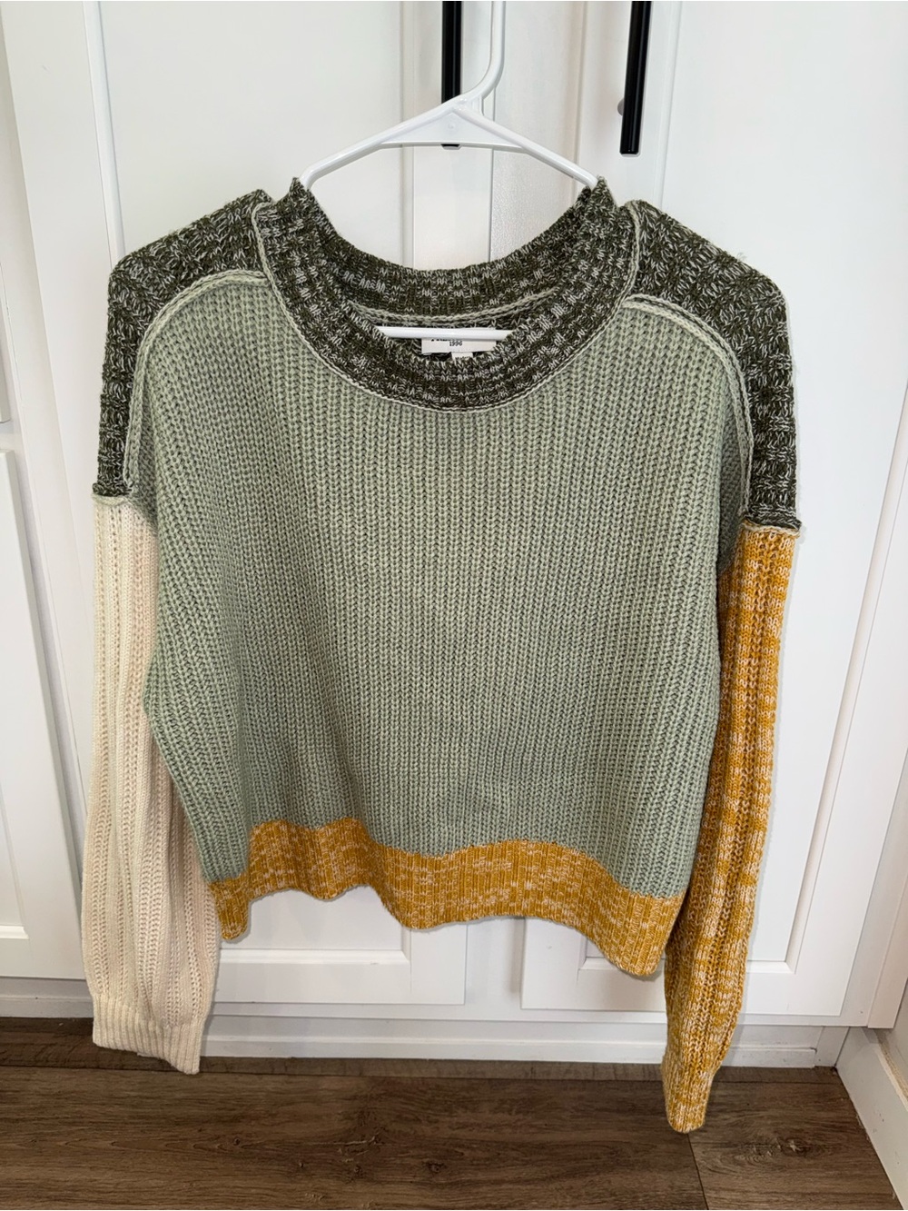 Green, cream, and mustard yellow color-blocked sweater